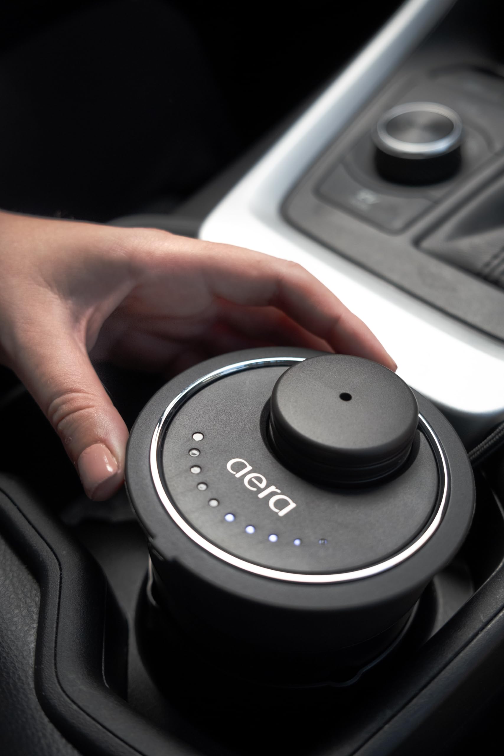 Aera Go Car Diffuser scent capsule slot illustrating fragrance options.