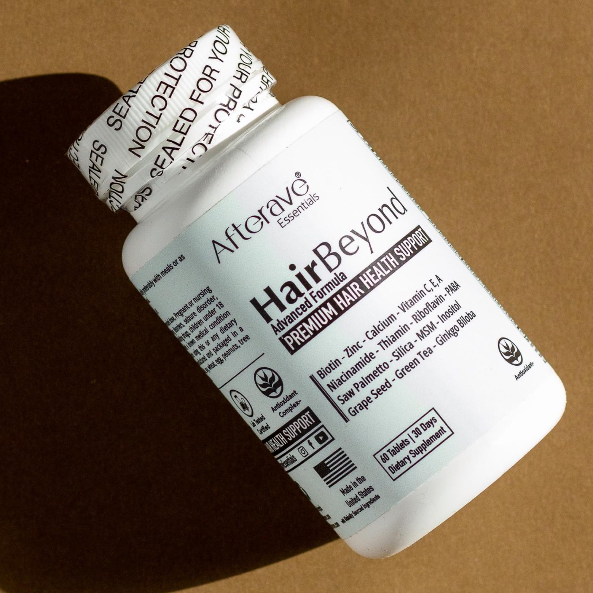 Afterave Essentials HairBeyond label close-up with branding and ingredient notes