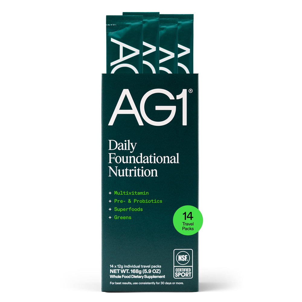 AG1 Athletic Greens powder scoop for daily gut-supporting nutrition.