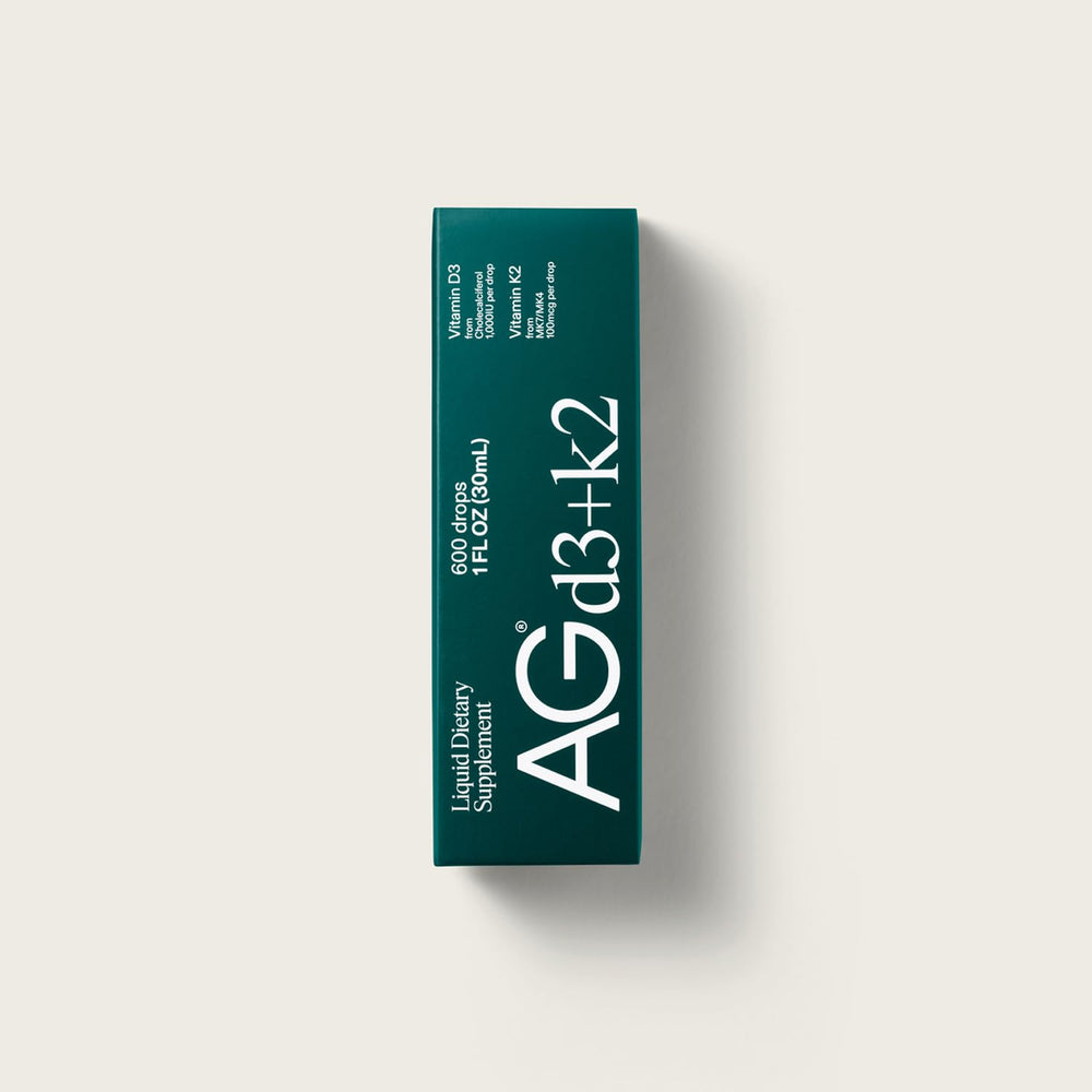 AG1 D3+K2 drops dropper delivering a precise daily dose.