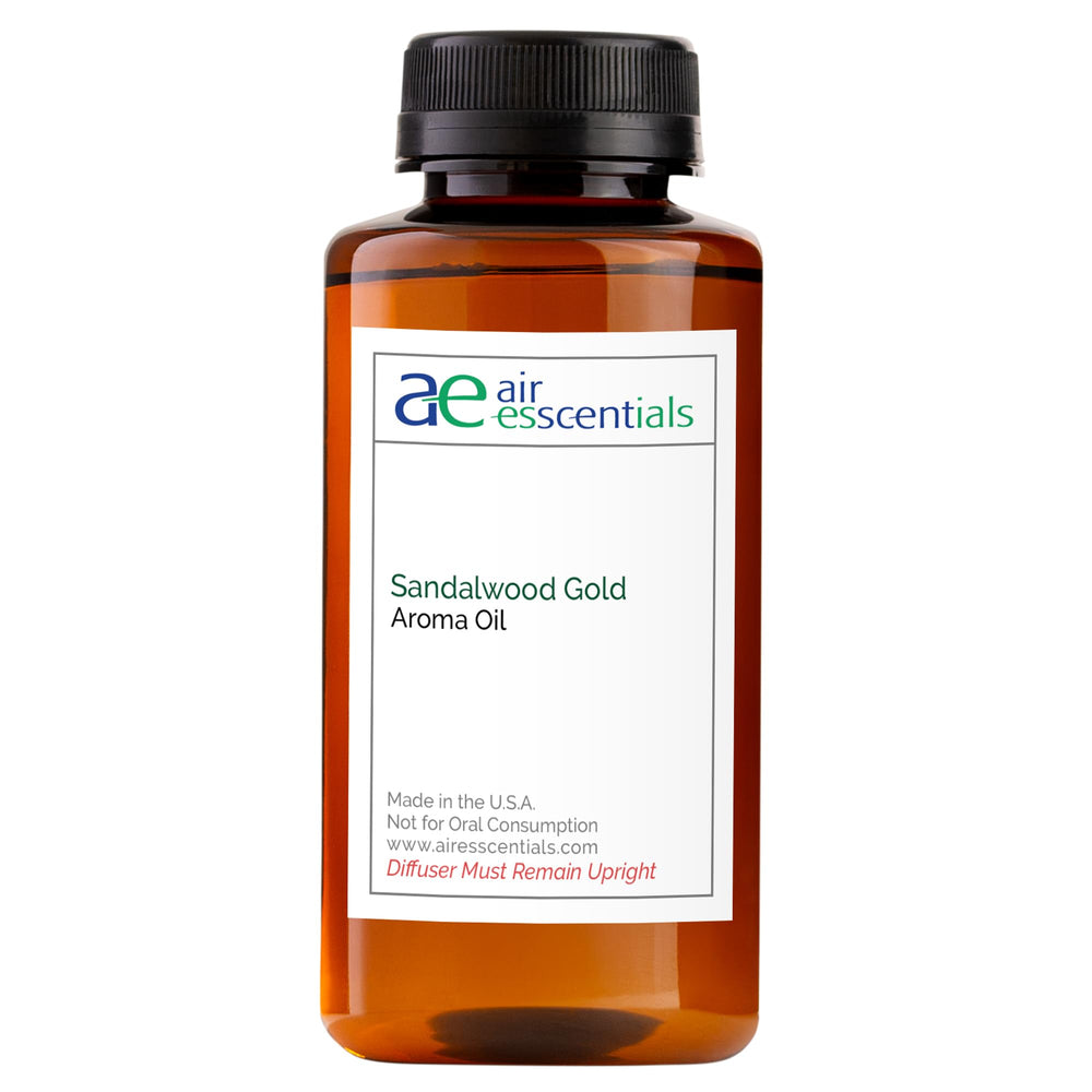 Air Esscentials Sandalwood Gold bottle ready for diffuser use, delivering refined fragrance at home