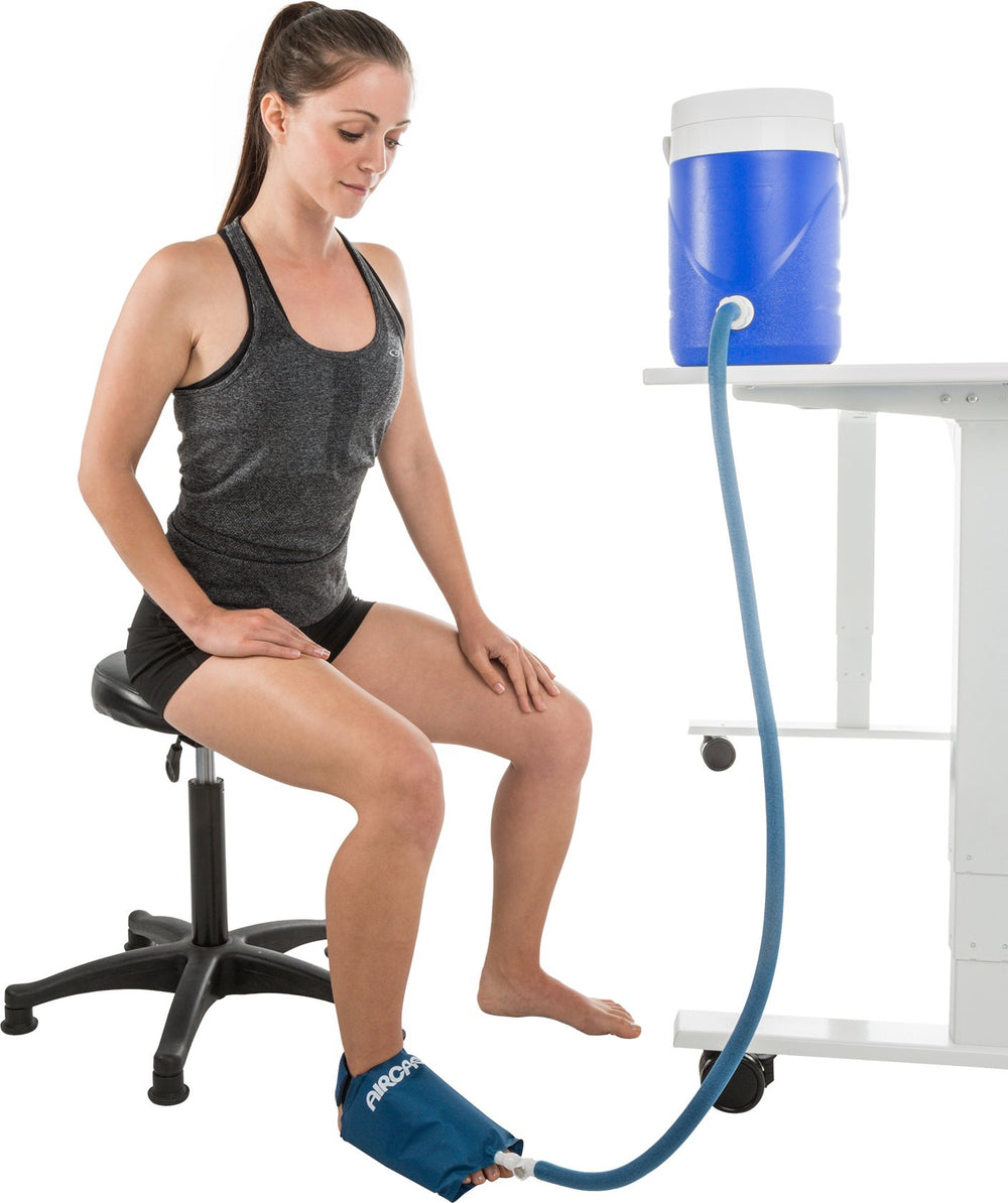 Aircast Foot Cryo/Cuff resting beside recovery supplies after treatment.