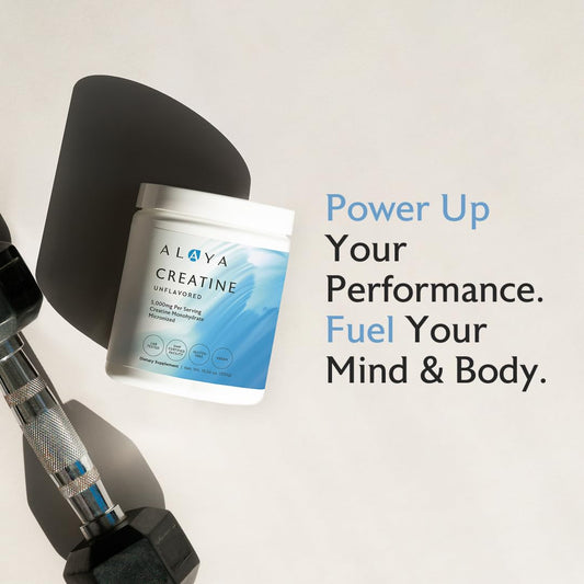Alaya Naturals creatine scoop dispensing the powder for accurate dosing.
