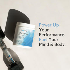 Alaya Naturals creatine scoop dispensing the powder for accurate dosing.