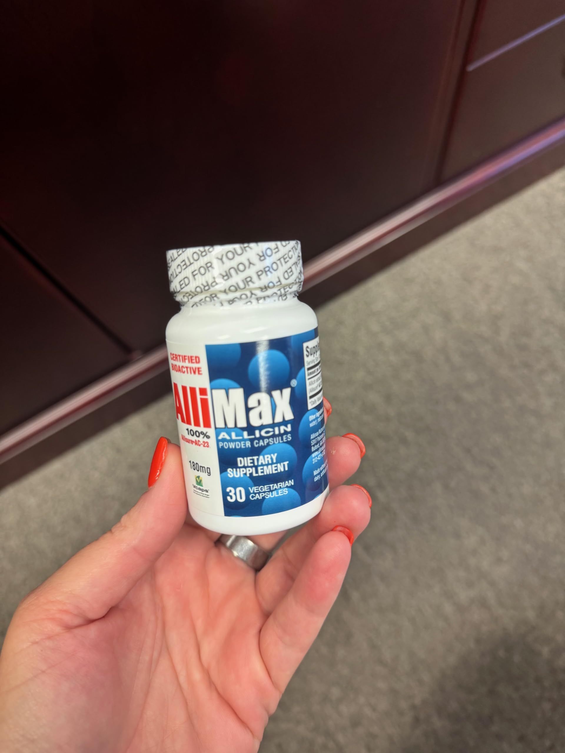 Allimax 180 mg bottle back lists ingredients and usage guidance for responsible supplementation