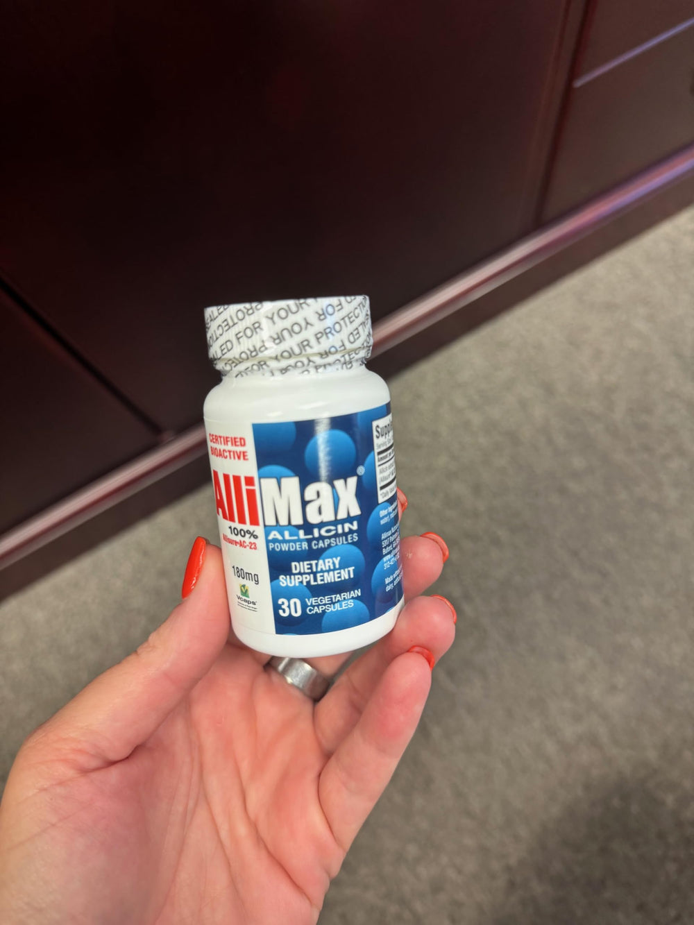 Allimax 180 mg bottle back lists ingredients and usage guidance for responsible supplementation