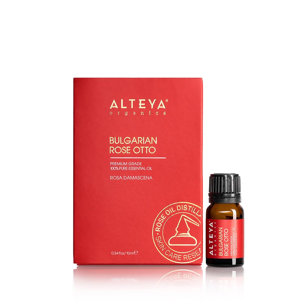Alteya Organics Rose Essential Oil bottle pour for calming aromatherapy and skin care prep.