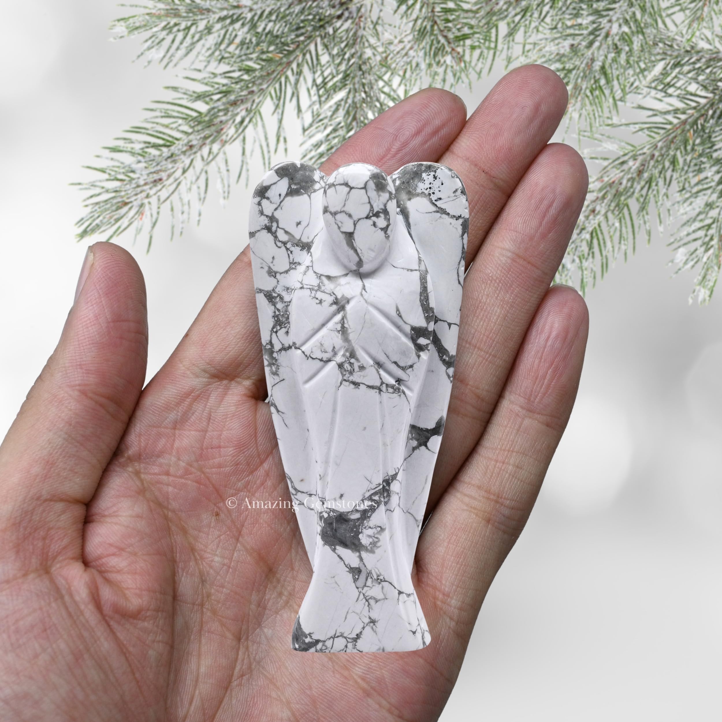 Amazing Gemstone Howlite Angel held in hand for portability and comfort
