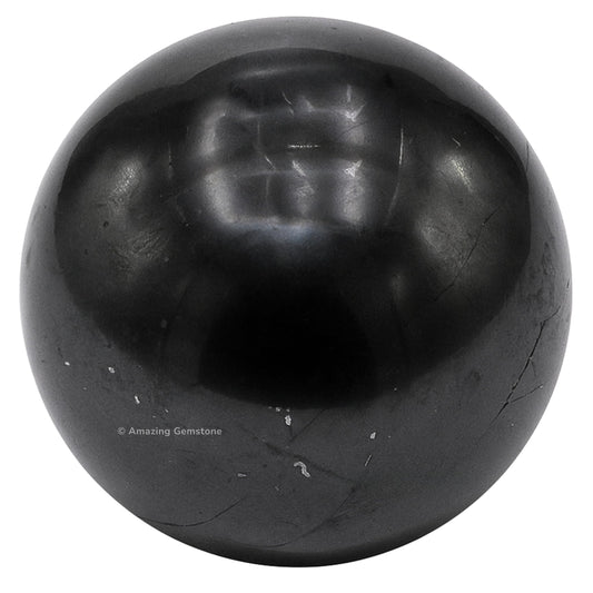 Closeup of Amazing Gemstone Shungite ball highlighting natural texture.