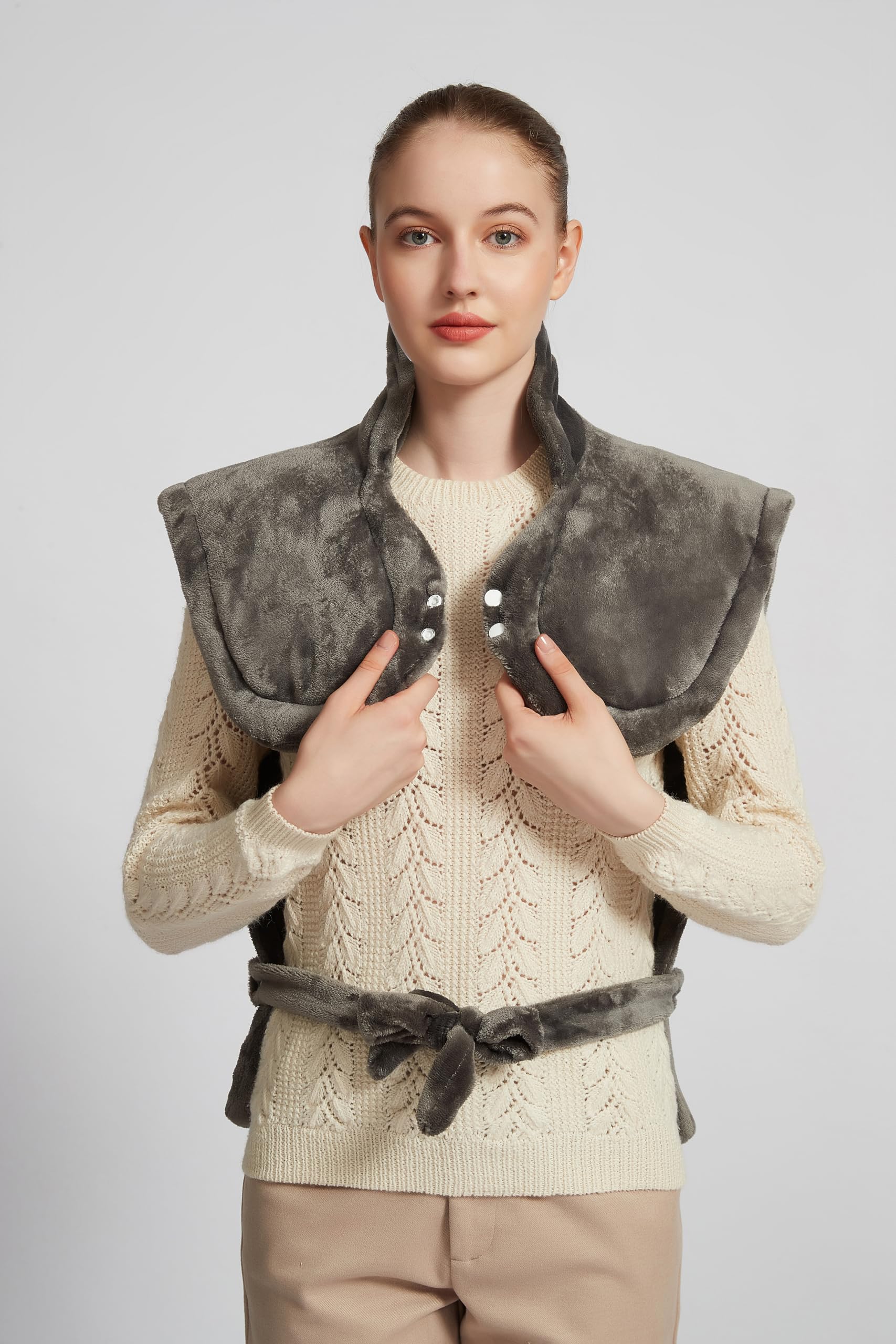 Ambershine XXXL heating pad spread on bed for full-body warmth across back and shoulders.