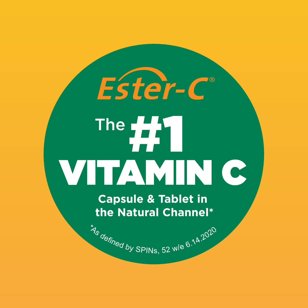 Close-up of American Health Ester-C tablets showing smooth texture.