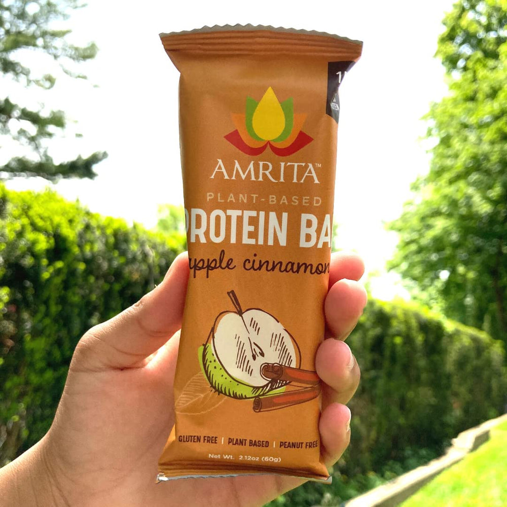 Amrita nut-free bar on hand indicates portable energy for active days.