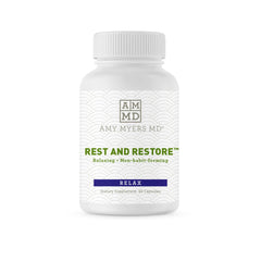 Amy Myers MD Rest and Restore bottle on nightstand promotes calm nightly preparation.