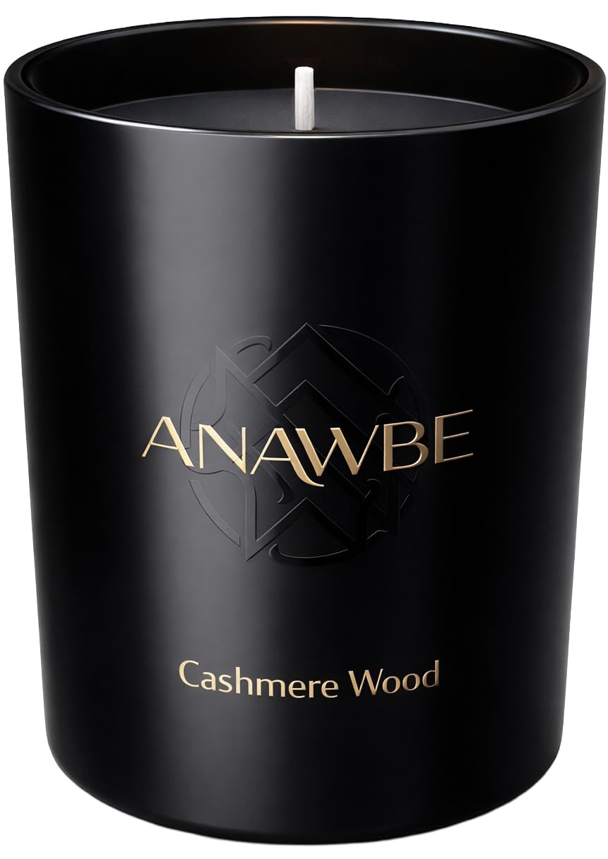 ANAWBE Cashmere Wood candle in a black vessel for elegant home ambiance.