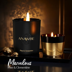 ANAWBE Pine & Clementine candle in dark vessel highlighting cedar and pine notes.