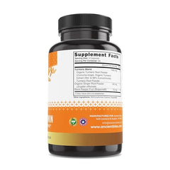 Raw ginger root and black pepper beside Ancient Bliss capsules