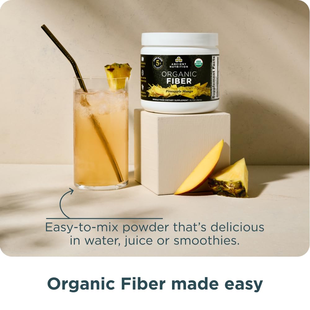Ancient Nutrition Organic Fiber Powder pineapple mango powder dissolving in liquid.