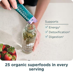 Ancient Nutrition SuperGreens on a kitchen counter with berries