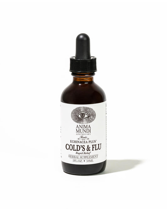 Anima Mundi Apothecary Cold's & Flu Tonic bottle on a wooden table, supports daily immune wellness.