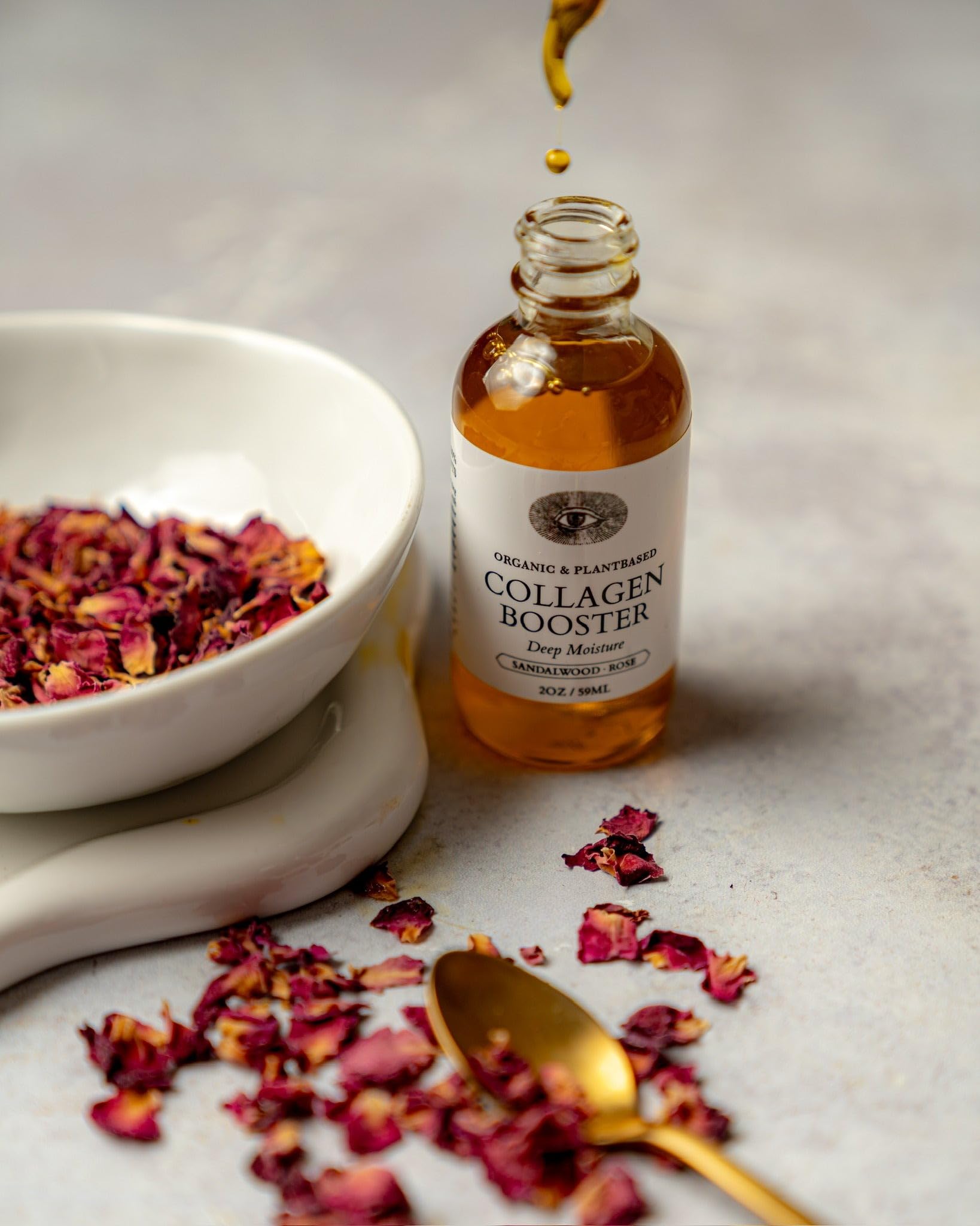 Anima Mundi Collagen Booster applying with gentle massage to improve absorption