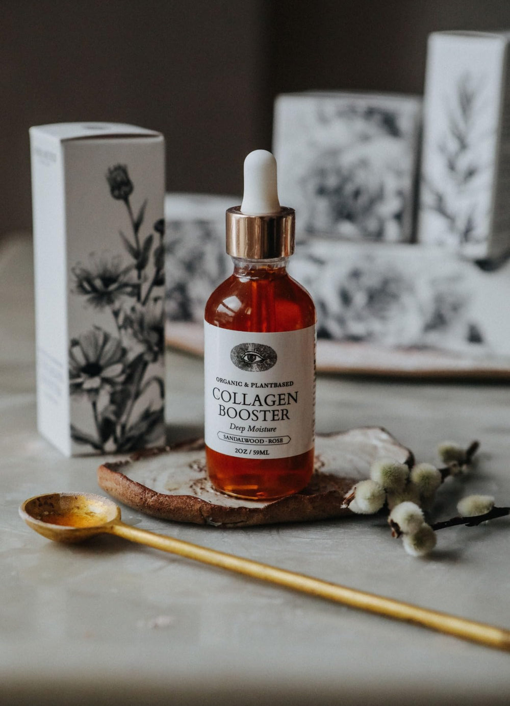 Anima Mundi Collagen Booster oil dropper shows silky texture for easy application