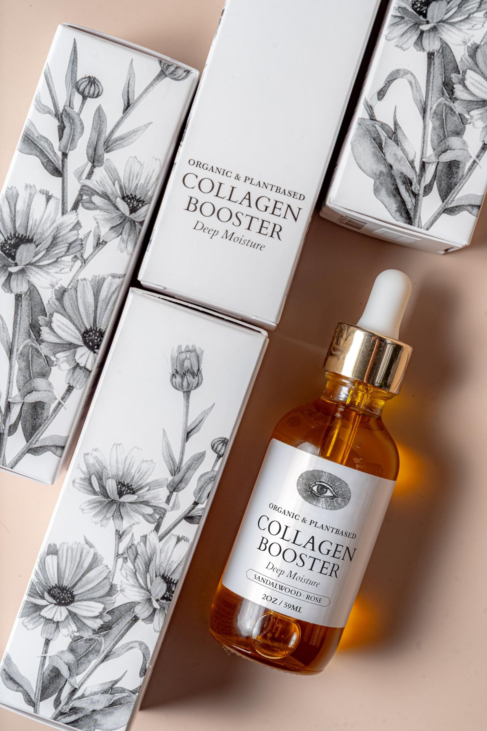 Anima Mundi Collagen Booster rose-petal closeup highlighting nourishing botanical oils for glow
