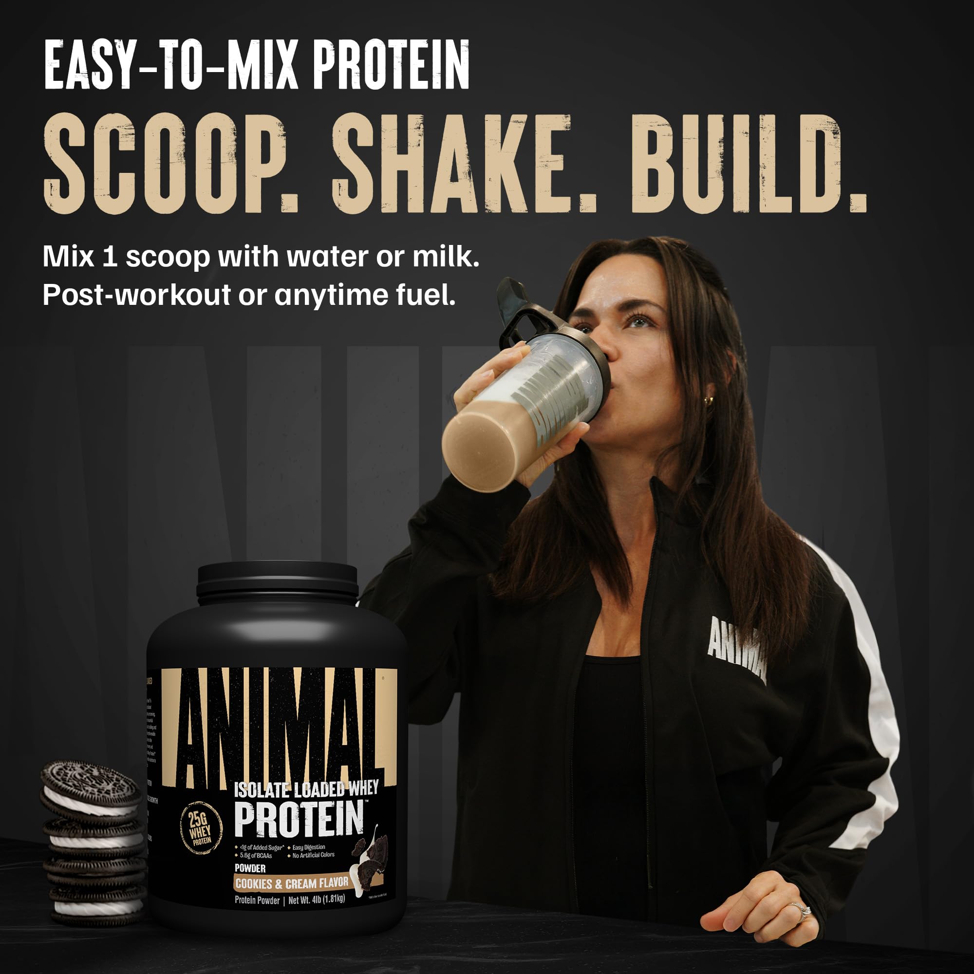 Scoop of Animal Whey Isolate showing powder texture and label