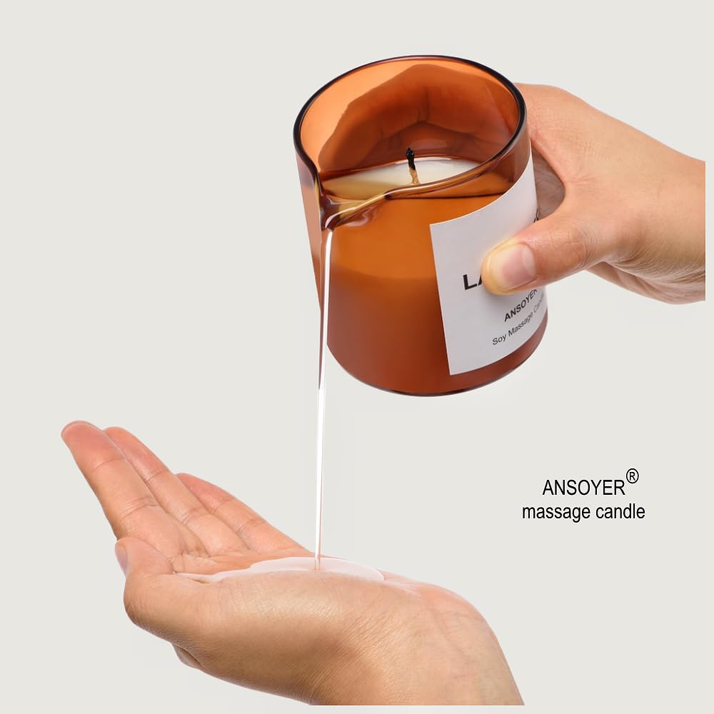 ANSOYER Massage Oil Candle pour into hand showing warm oil texture