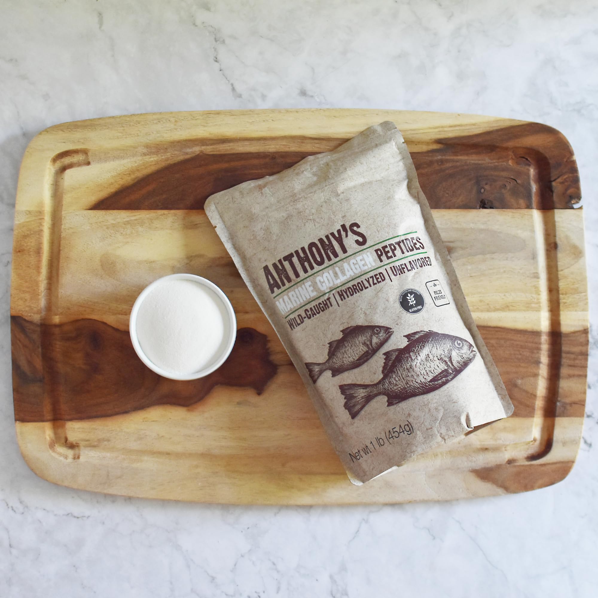 Anthony's hydrolyzed marine collagen jar open, ready to mix into hot beverages and recipes.