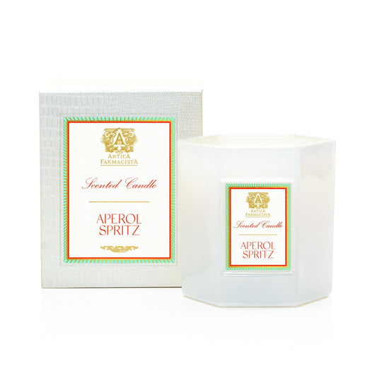 Antica Farmacista Aperol Spritz candle close-up highlights warm glow and citrus aroma.