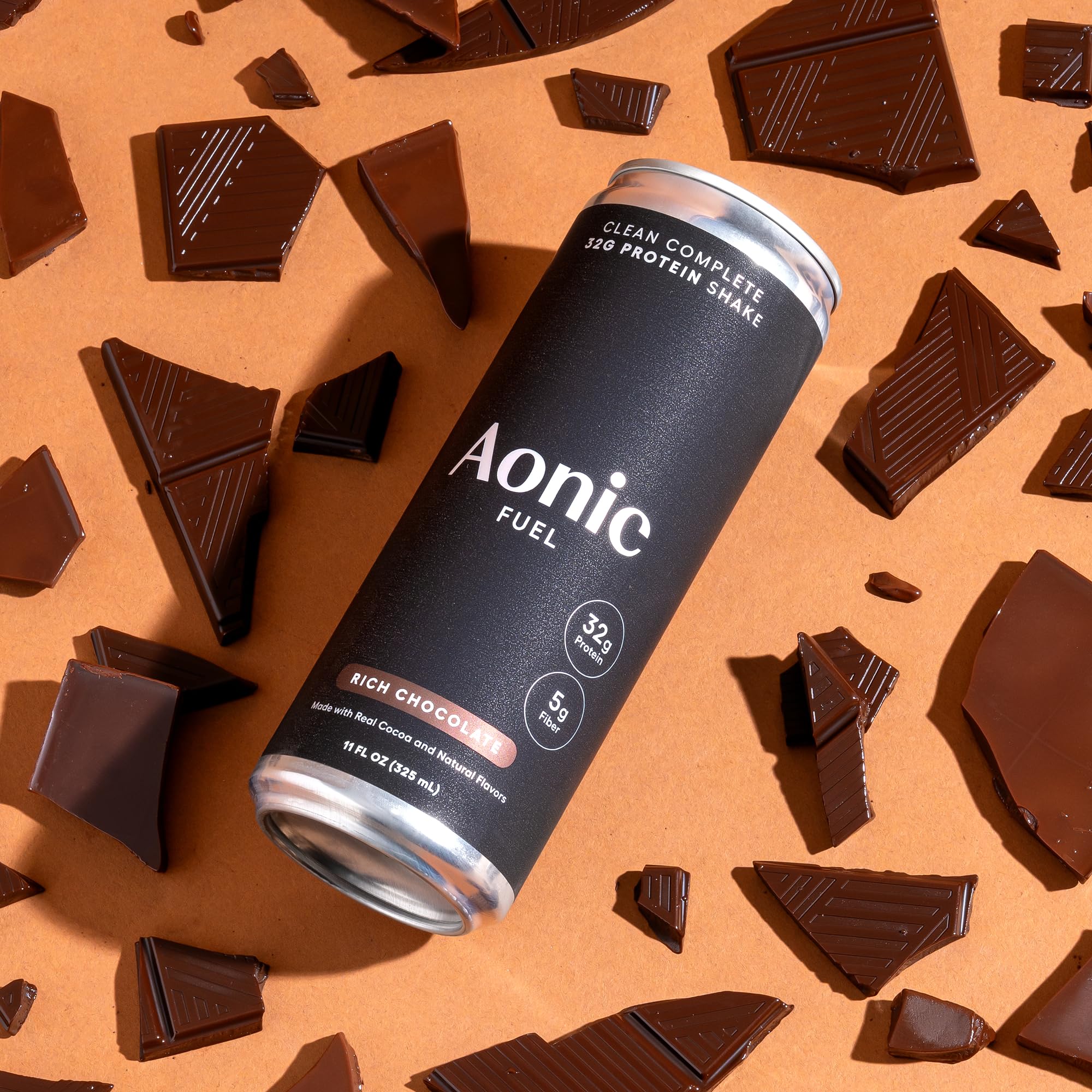 AONIC Fuel 11 oz serving shown alongside a glass of milk