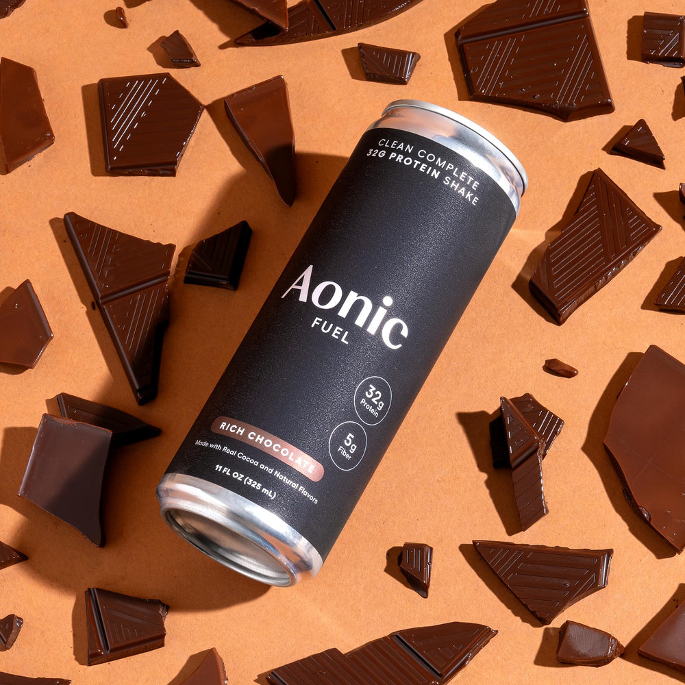 AONIC Fuel 11 oz serving shown alongside a glass of milk
