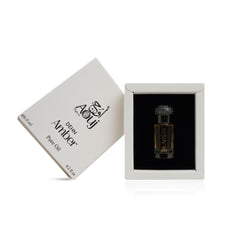 AOUJ Dehn fragrance oil pour close-up showing amber-vanilla warmth