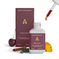 Apothekary Wine Down bottle pour showing alcohol-free sleep support in a calm setting.