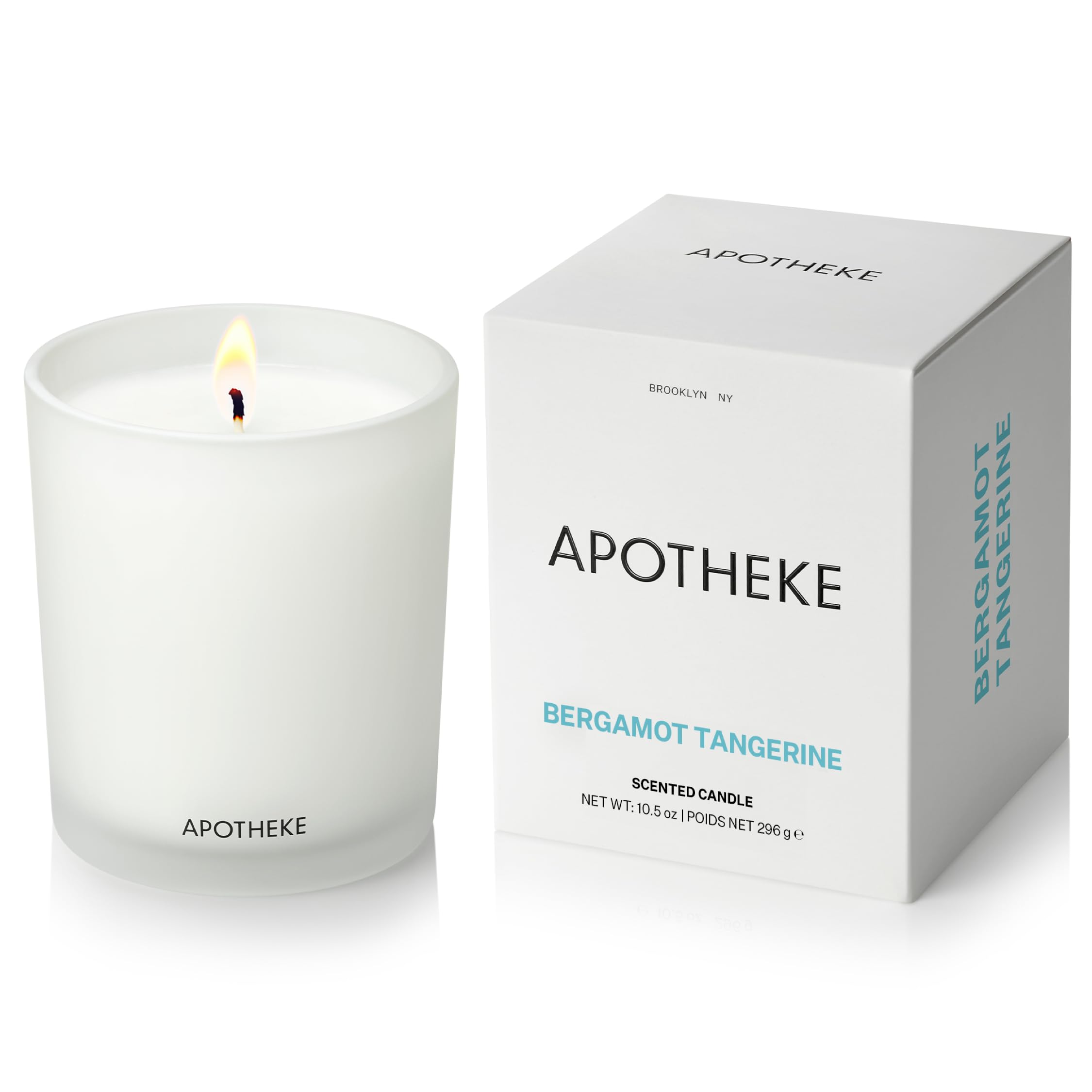 APOTHEKE Bergamot Tangerine candle in glass jar enhances living room ambiance.
