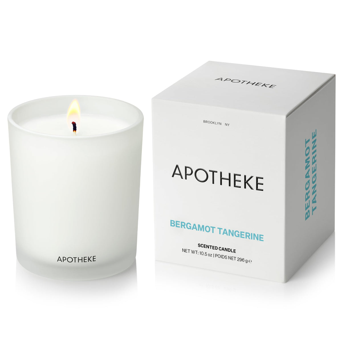 APOTHEKE Bergamot Tangerine candle in glass jar enhances living room ambiance.
