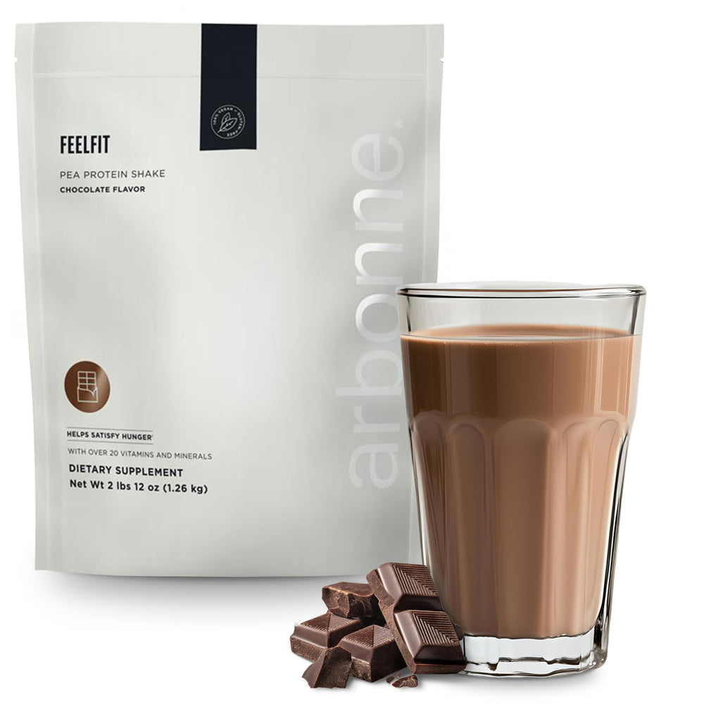 Arbonne Feelfit chocolate pea protein shake bottle pour, plant-based protein for muscle support