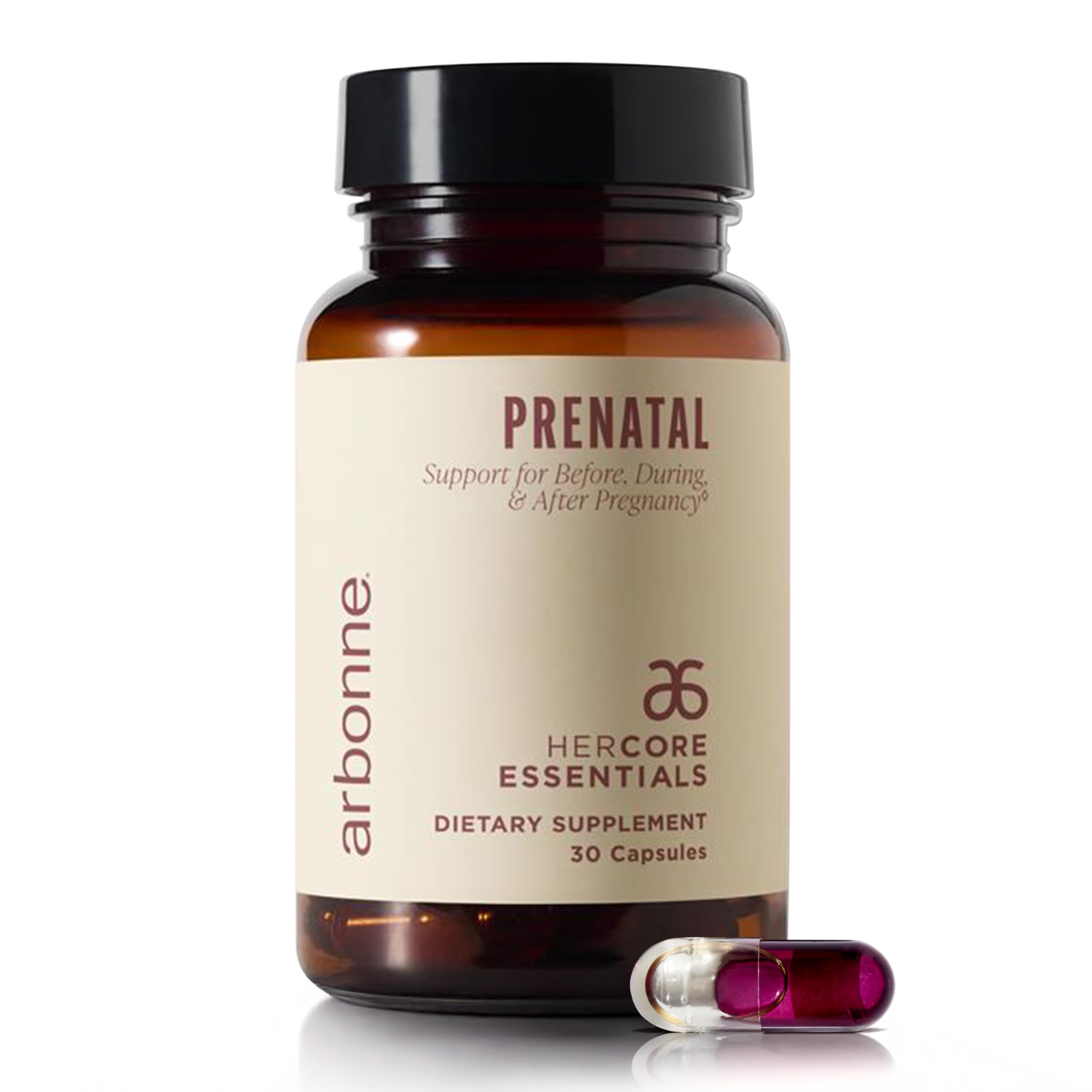 Arbonne HerCore Essentials Prenatal bottle on a clean counter with vegan DHA and folate nutrients.