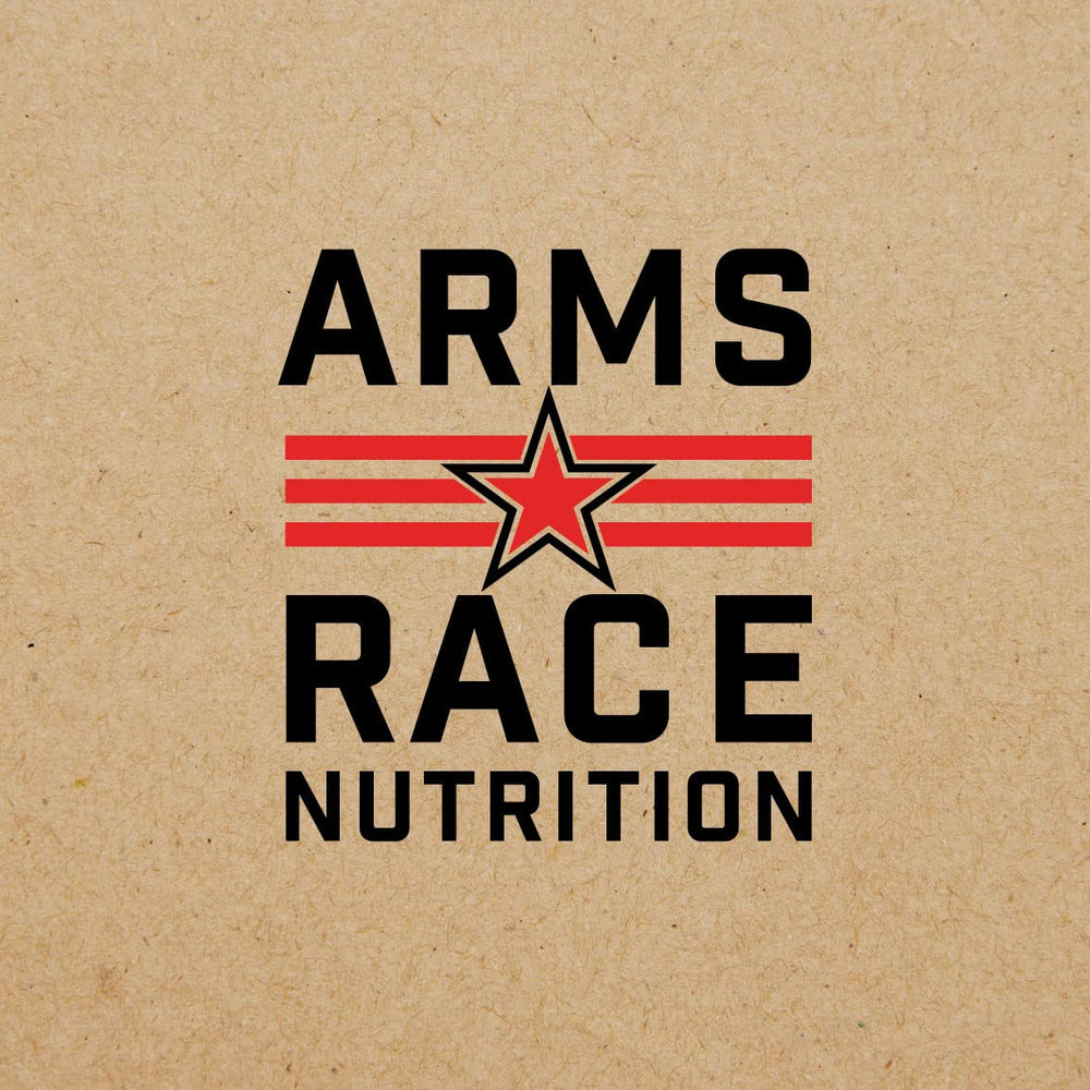 Arms Race Immunity Greens chocolate bliss flavor beside a measuring scoop.