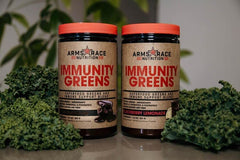 Arms Race Immunity Greens prepared drink in glass shows vibrant color.