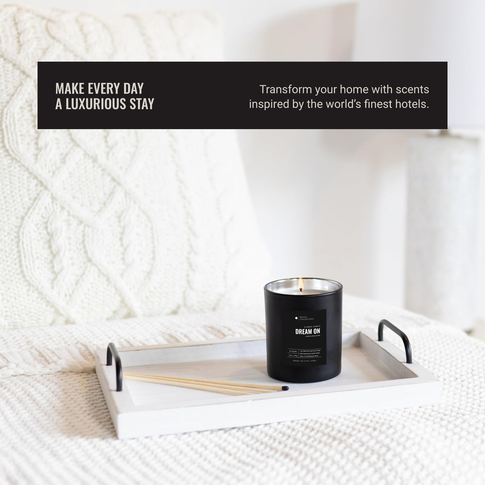 Aroma360 Sweetest Taboo Deluxe Candle amber wax glows warmly.
