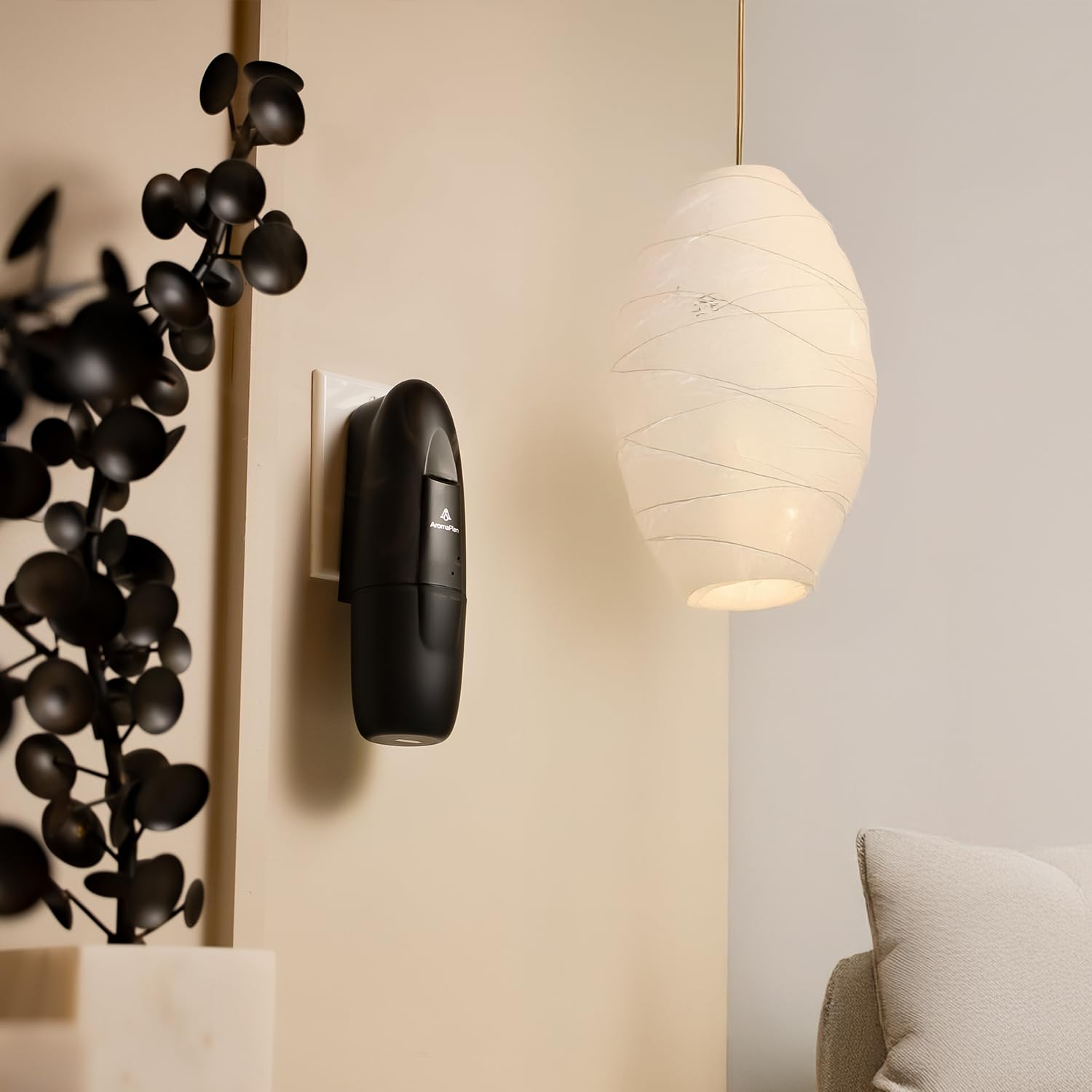 AROMAPLAN Dubai fragrance bottle beside diffuser for a fresh ambiance.