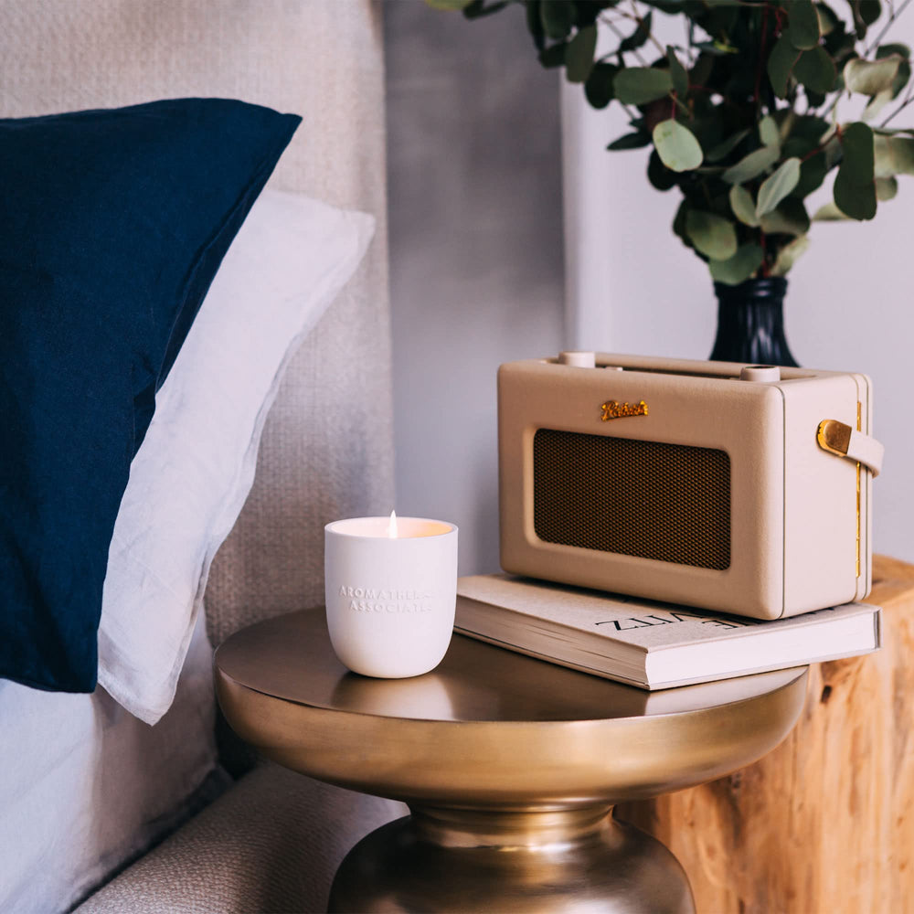 Aromatherapy Associates Deep Relax candle with sandalwood notes for tranquil evenings.