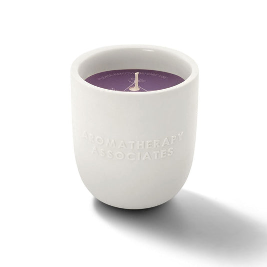 Aromatherapy Associates De-Stress Candle lit, releasing calming aromas for focused moments