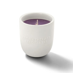 Aromatherapy Associates De-Stress Candle lit, releasing calming aromas for focused moments