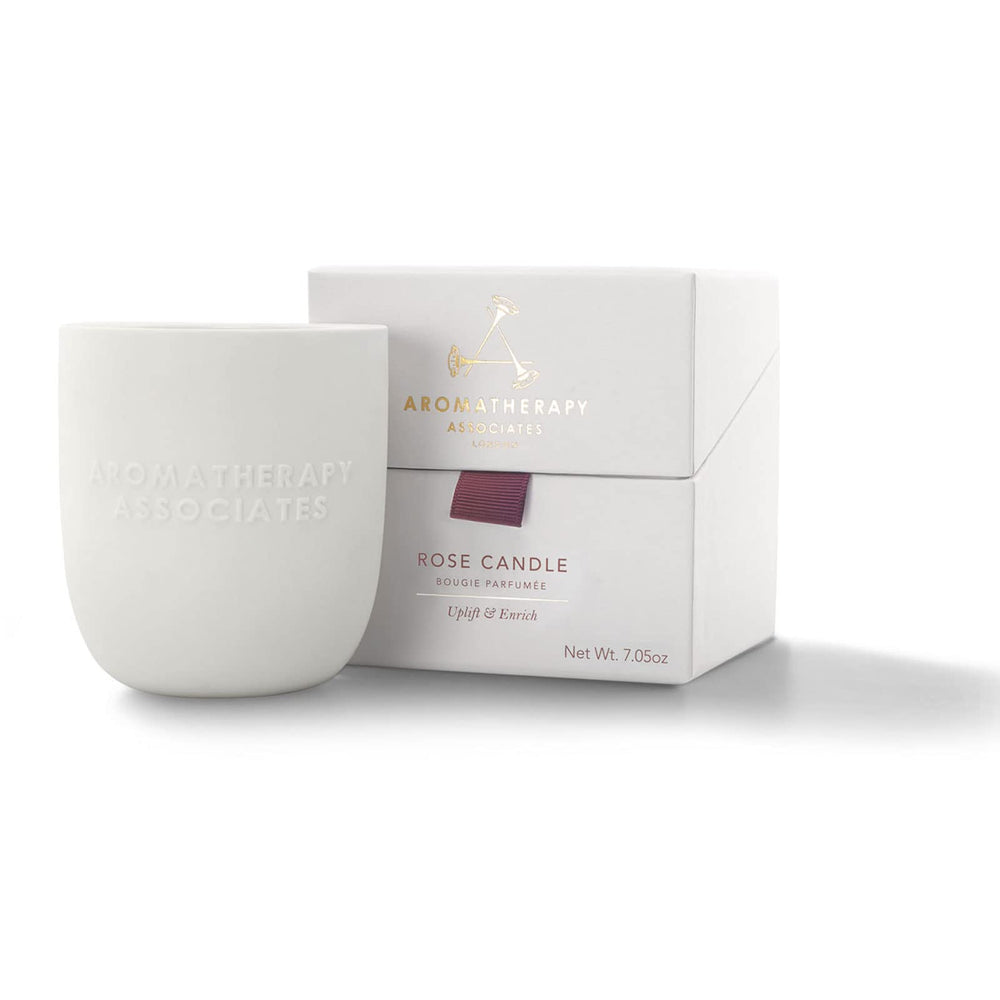 Aromatherapy Associates Rose Candle in a ceramic holder for luxurious ambience.