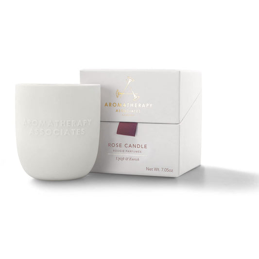 Aromatherapy Associates Rose Candle in a ceramic holder for luxurious ambience.