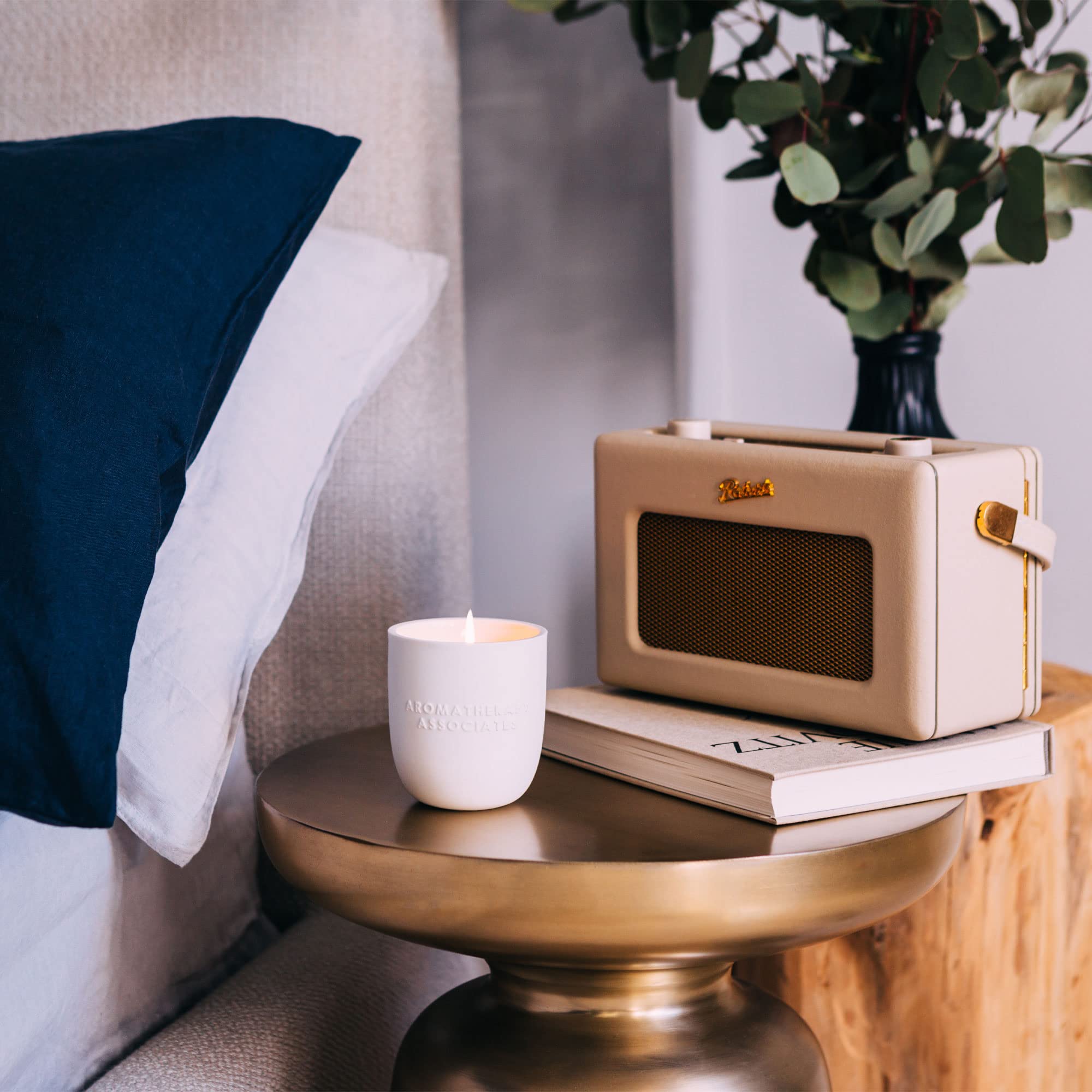 Aromatherapy Associates Rose Candle glowing softly for long-lasting ambience.