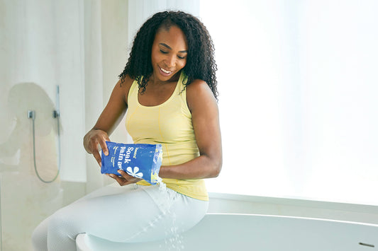 ASUTRA magnesium chloride bath flakes in a warm tub for a soothing soak.