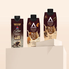 Atkins Coffee Lovers serving glass with steam suggests on-the-go protein power.